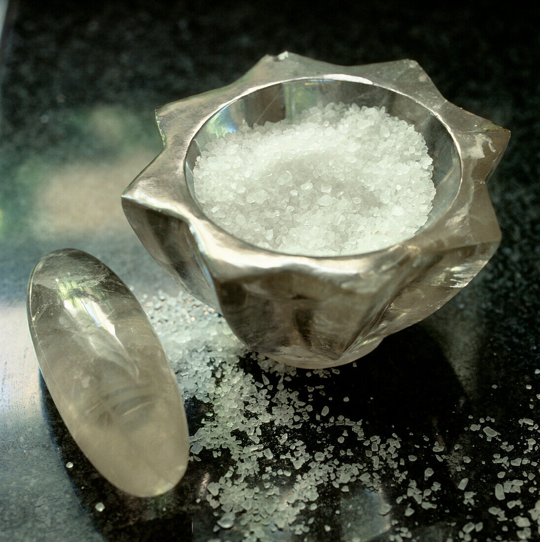 Sea salt in a glass pestle and mortar