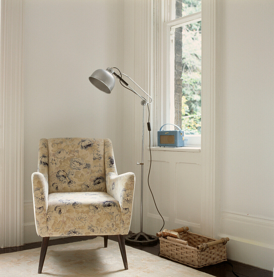 Living room corner with window armchair and reading light