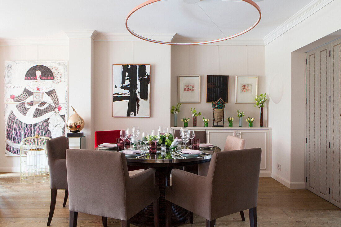 Artwork in dining room of contemporary London home England UK
