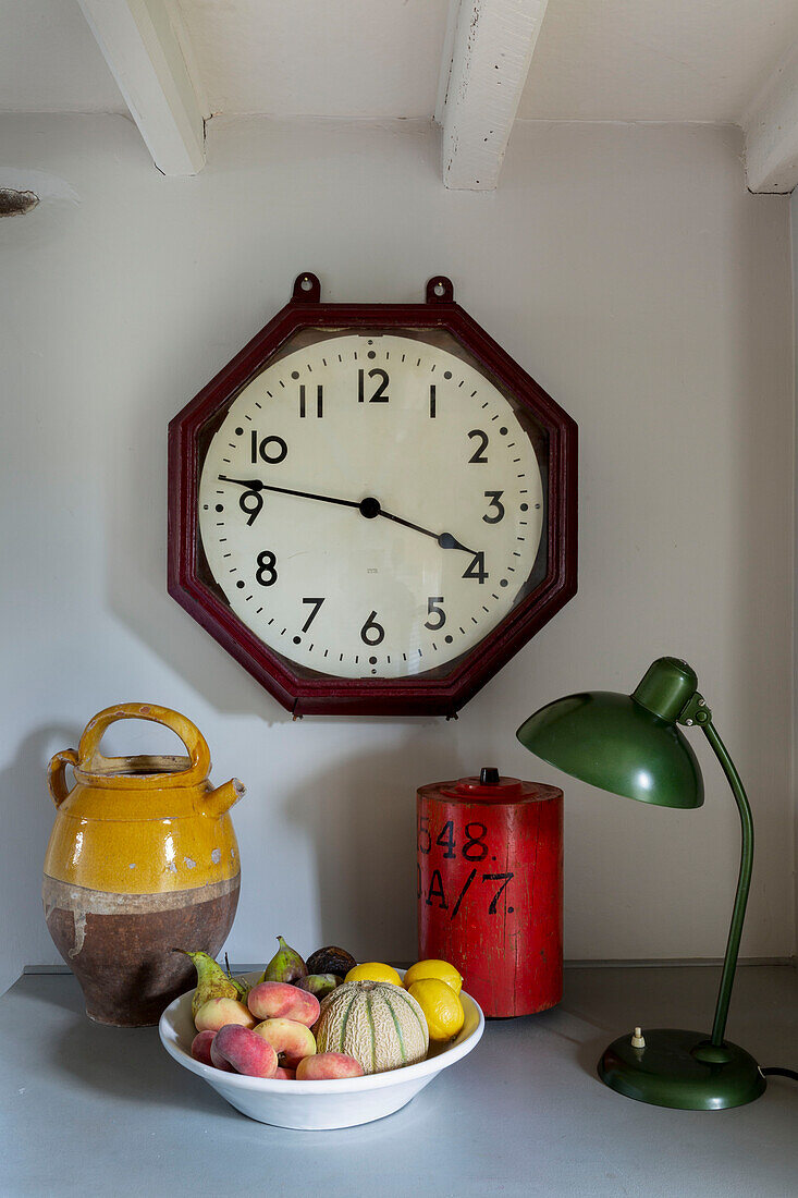 Vintage clock and lamp with fruit bowl in Cirencester home Gloucestershire UK