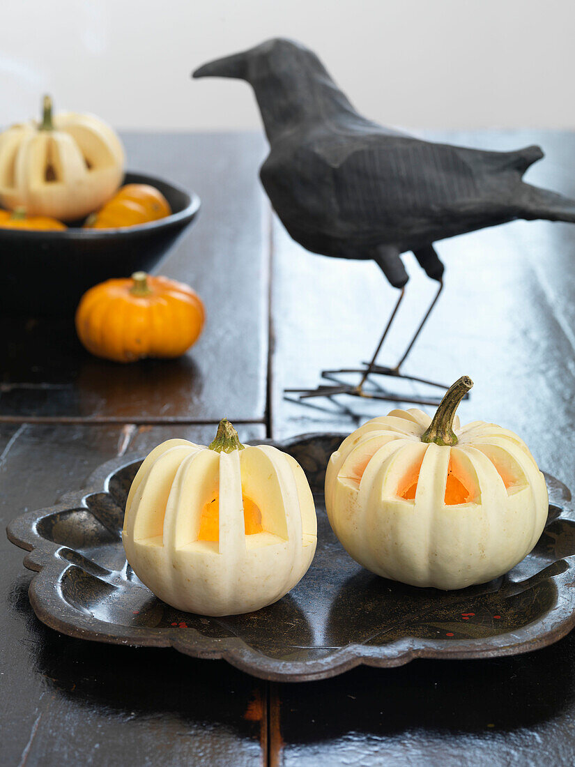 Black crow and carved pumpkins Brighton, East Sussex UK