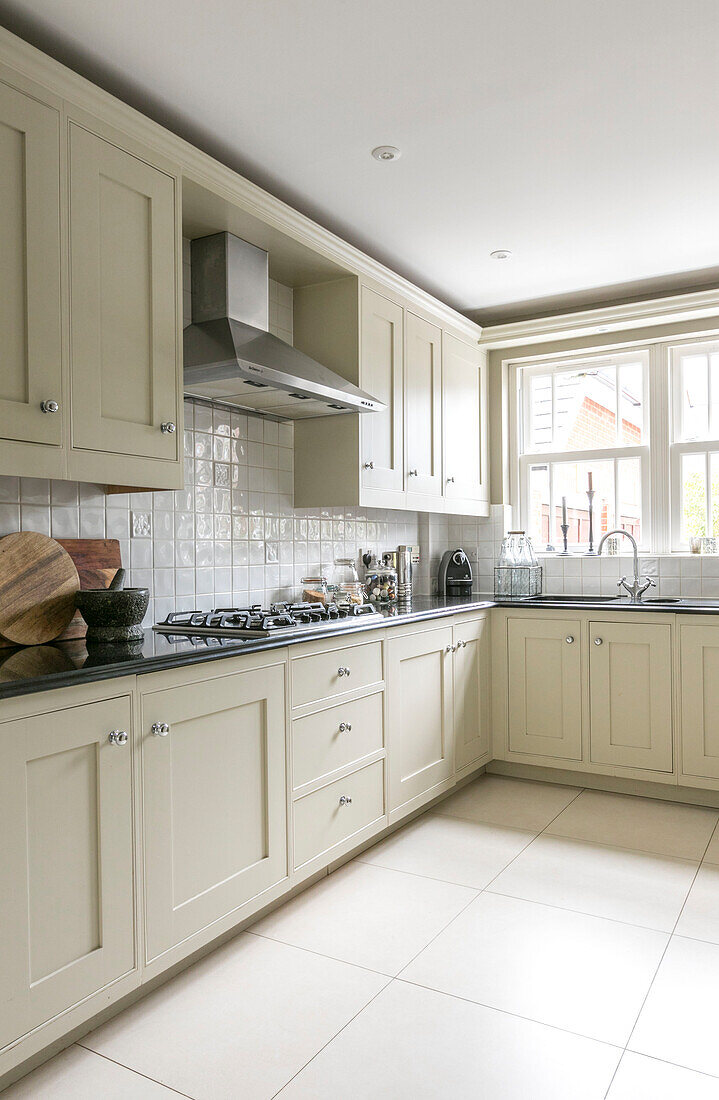 cream fitted kitchen in Guildford townhouse Surrey UK