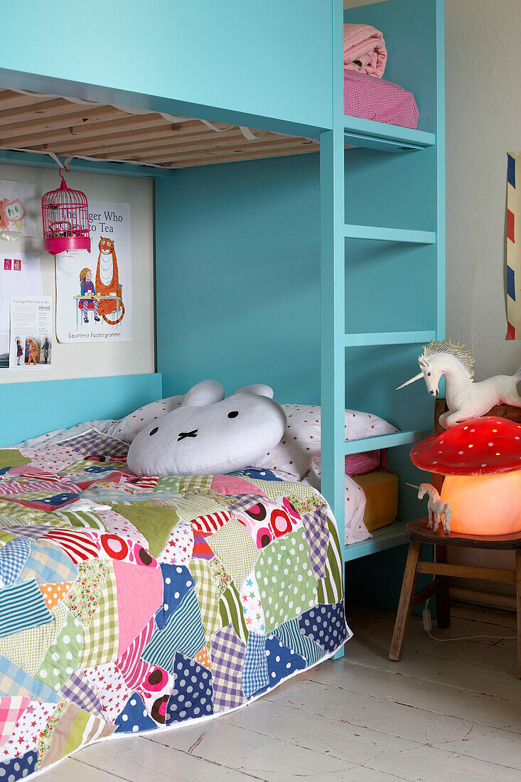 Child's bunkbeds with patchwork quilt