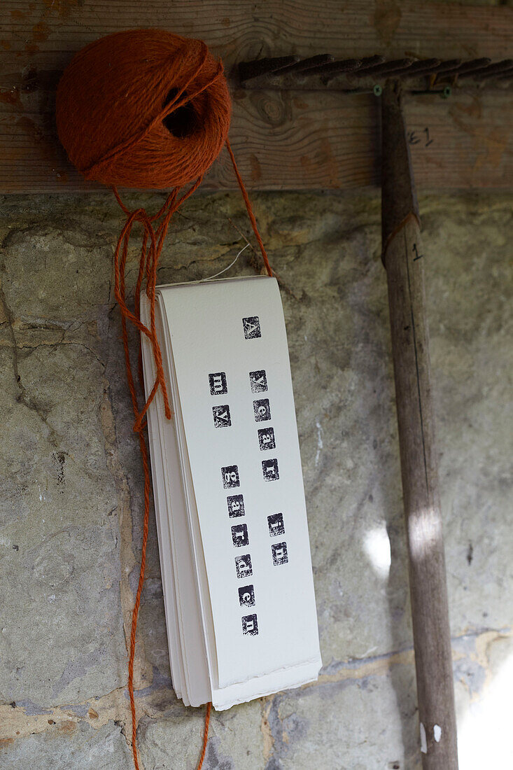 Gardening string and labels with rake in shed, St Lawrence, Isle of Wight, UK