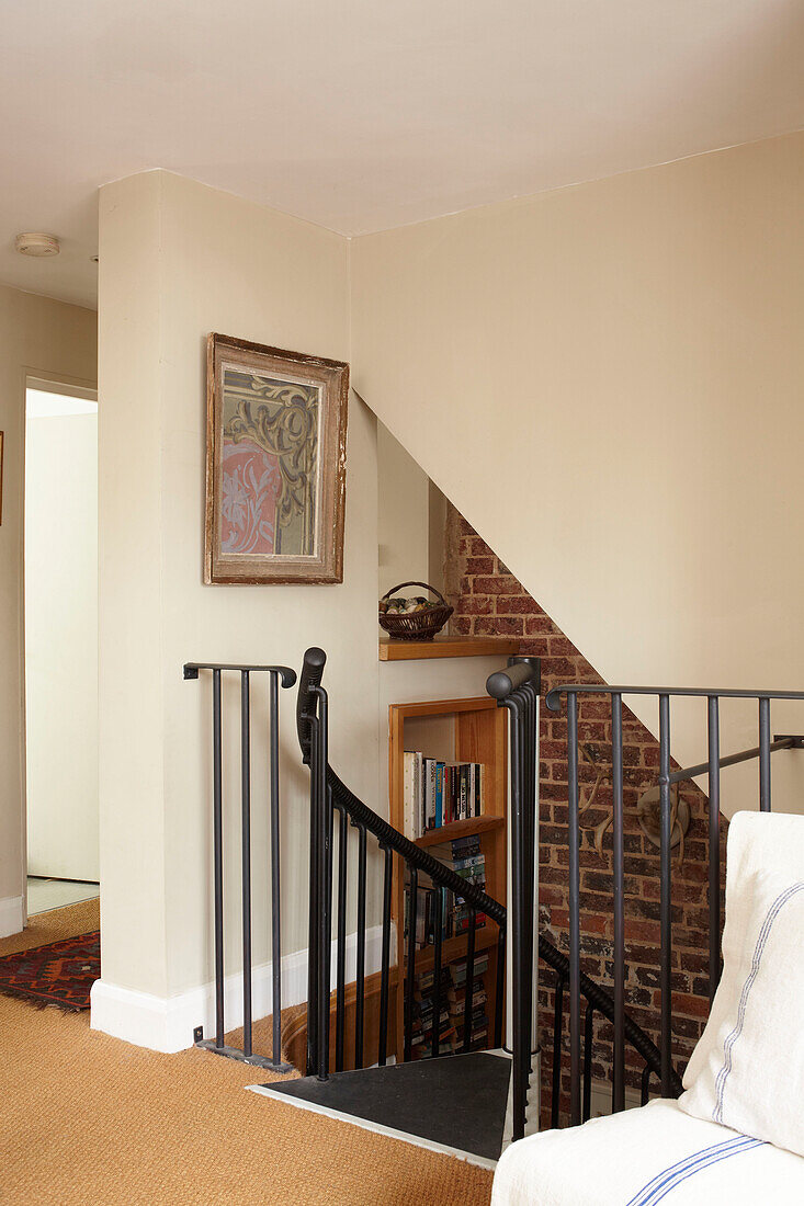 Black wrought iron staircase detail in semi-detached home UK
