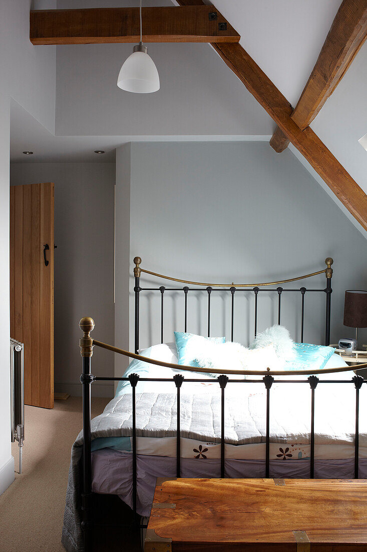 Metal bed in roof space of Somerset barn conversion England UK