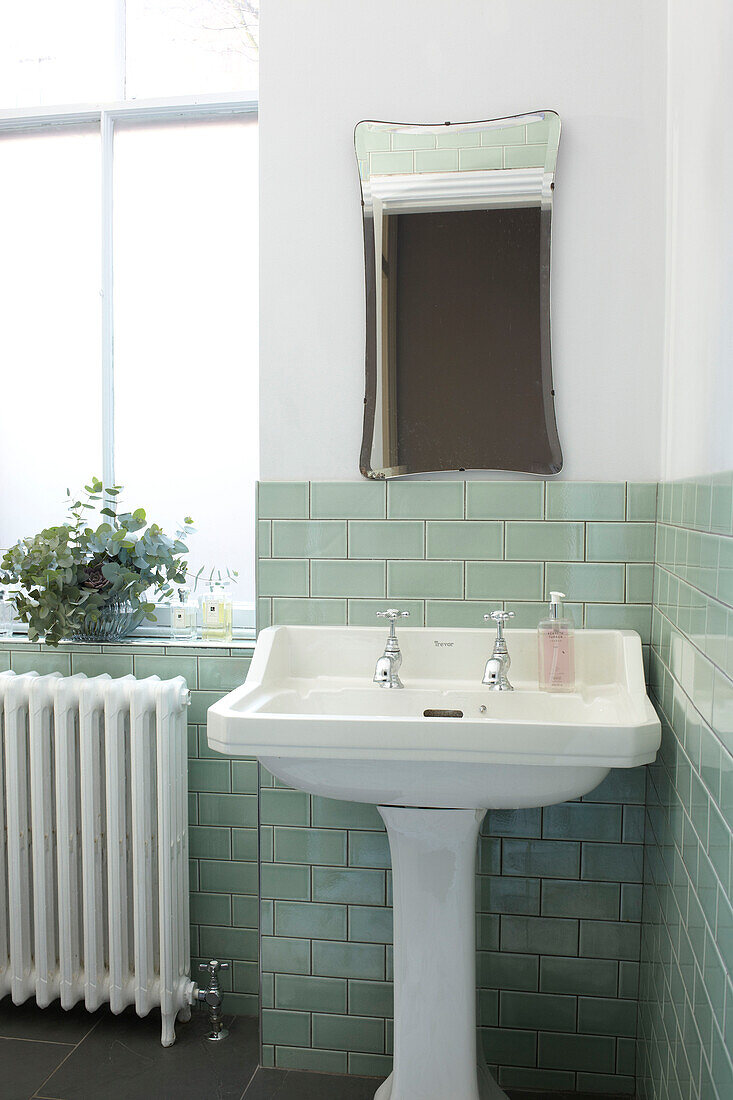 Green tiled bathroom in Scottish apartment building UK