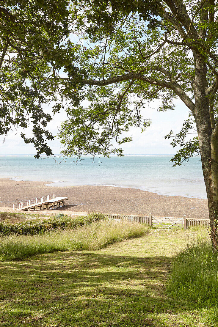 Shaded view to beach on the Solent in Binstead Isle of Wight, UK