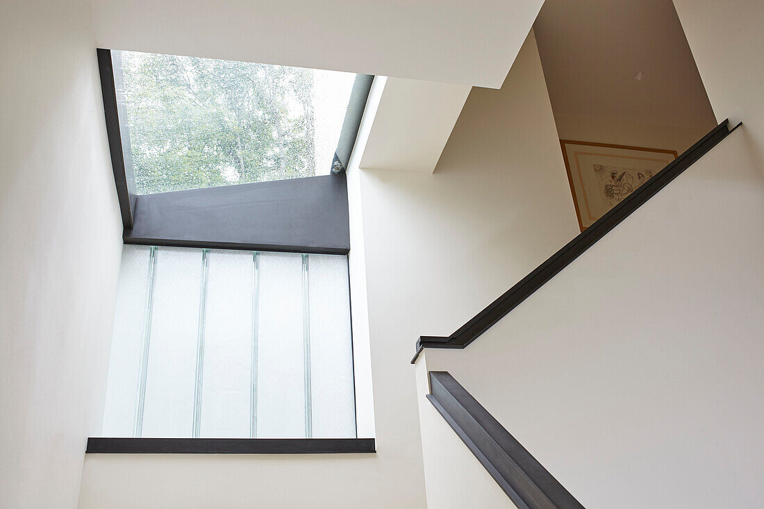 Low angle view of modern staircase and skylight in Isle of Wight home UK