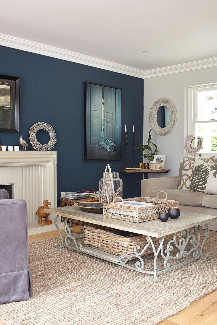 Low coffee table with rug and natural textures in Hague Blue living room Buckinghamshire UK