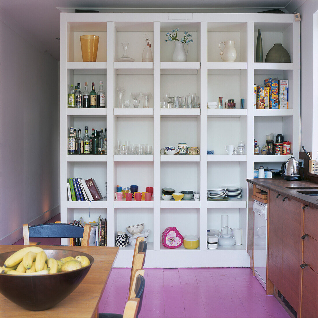 Kitchen with large wall partition storage unit
