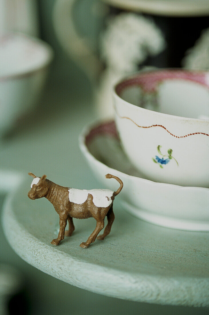 Still life with toy animal and crockery
