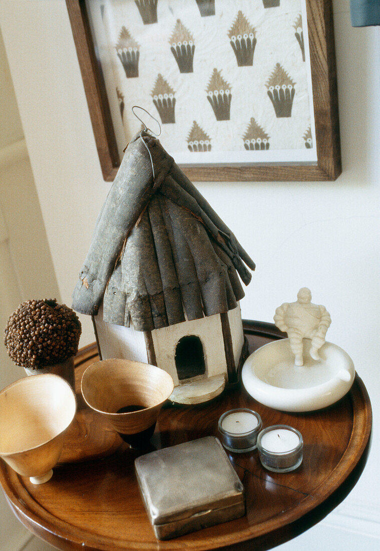 Close up of table top with treenware and a bird box