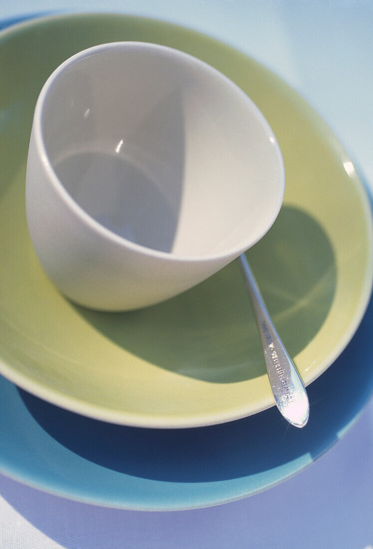 Close up of a fifties style crockery with silver plated teaspoon