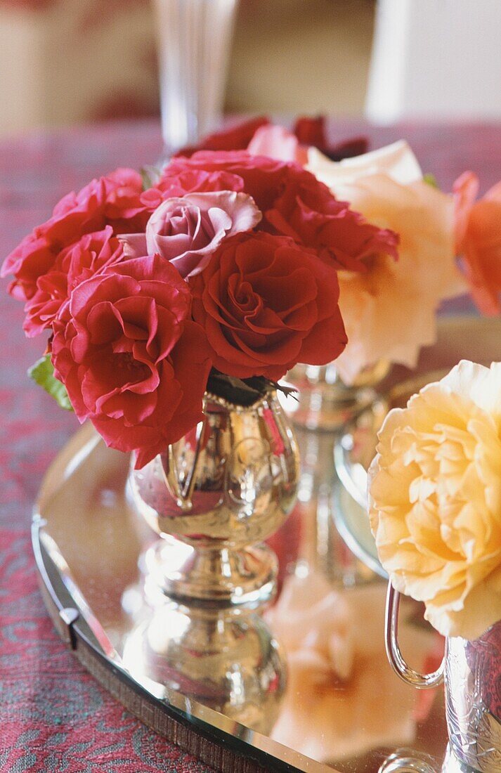 Posies of roses in silverware