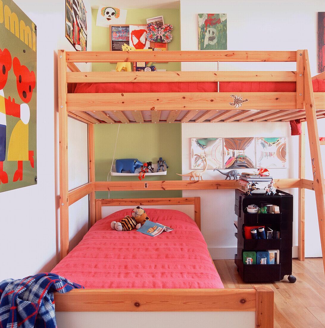 Children's bedroom with wooden sleeping platform and single bed