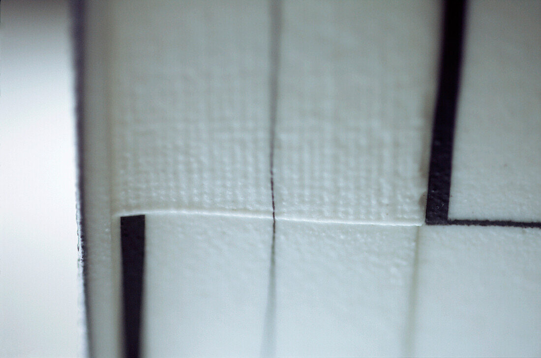 Detail and texture of a black and white porcelain pot
