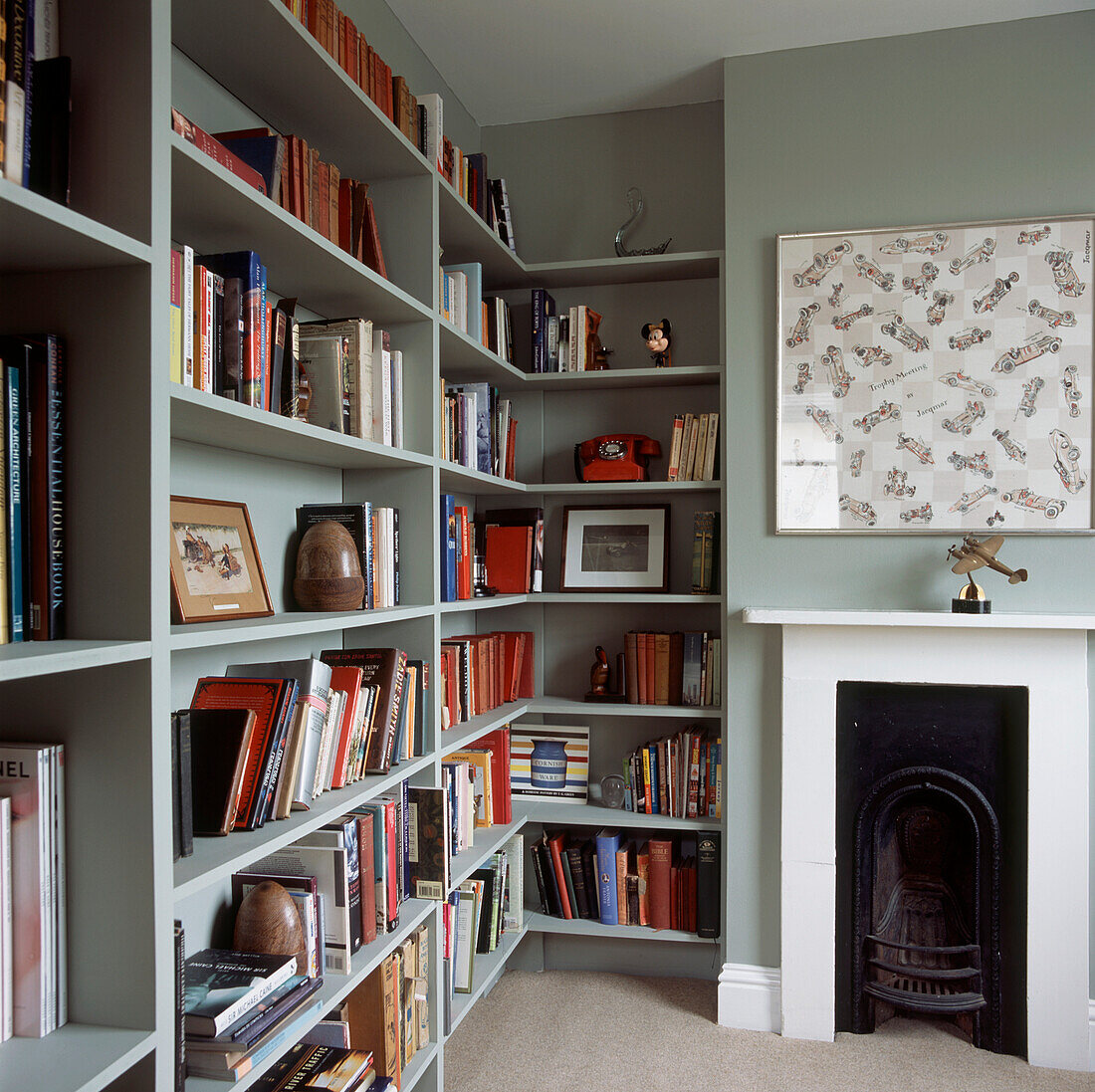 Study with racks of open shelving and storage space for books