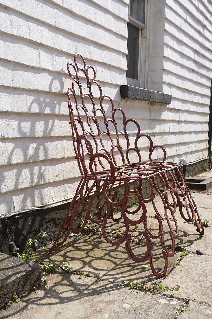 Detail of garden chair made from horse shoes