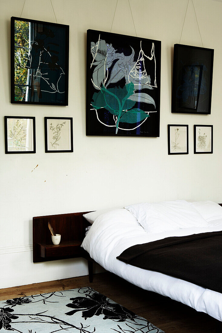 Modern art collection on bedroom wall