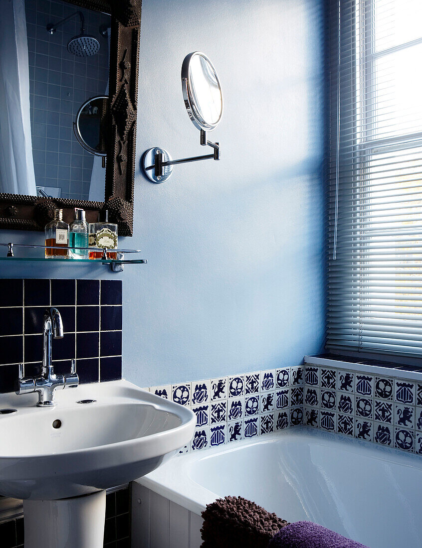 Bathroom with blue and white patterned wall tiles