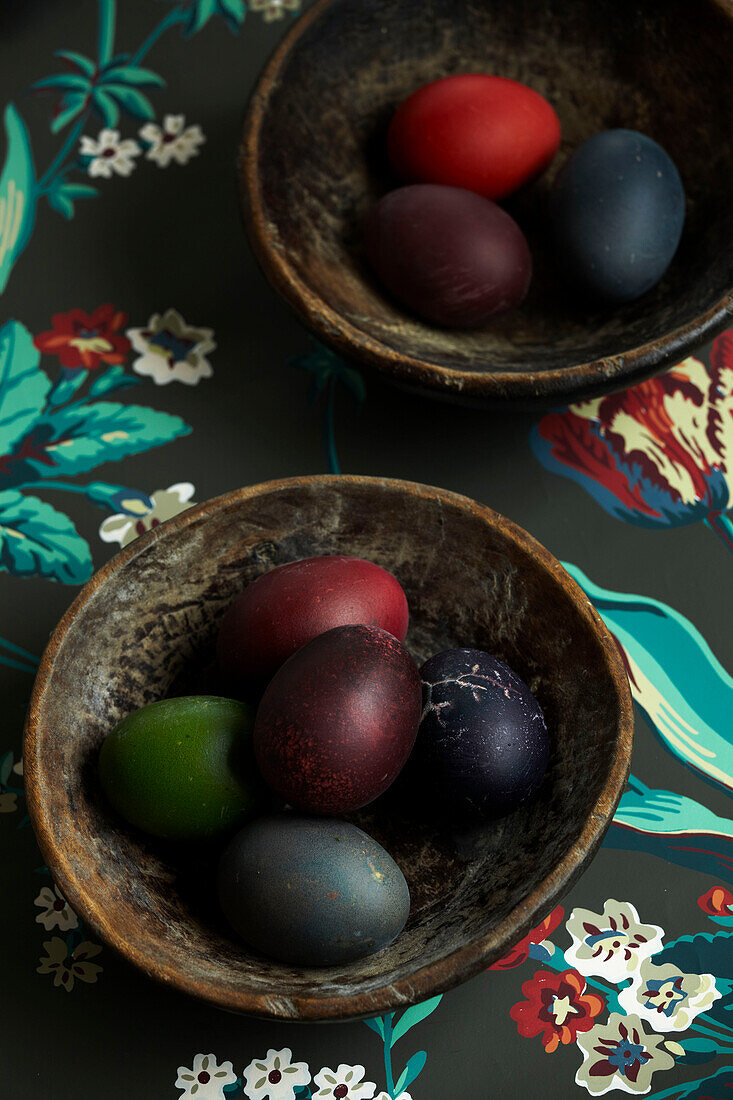 Bowls of dyed eggs on floral fabric