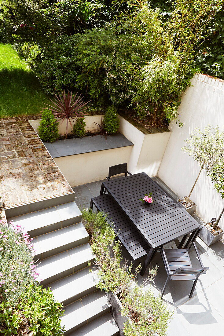 Elevated view of courtyard garden table and terrace, London, England, UK