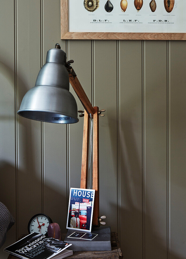 Vintage anglepoise on bedside table with paperback book, Rye, East Sussex, England, UK