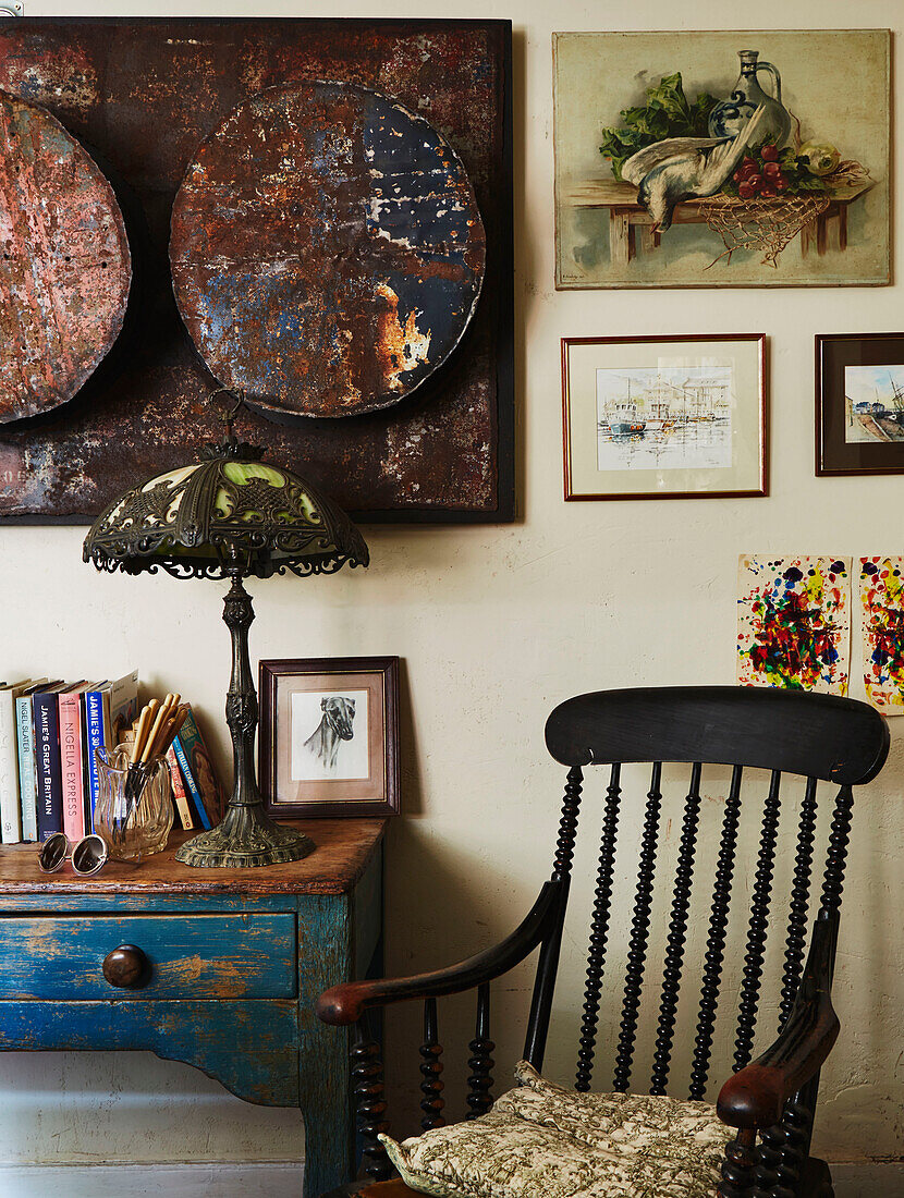 Vintage rocking chair and lamp with artwork in Evershot home, Dorset, Kent, UK