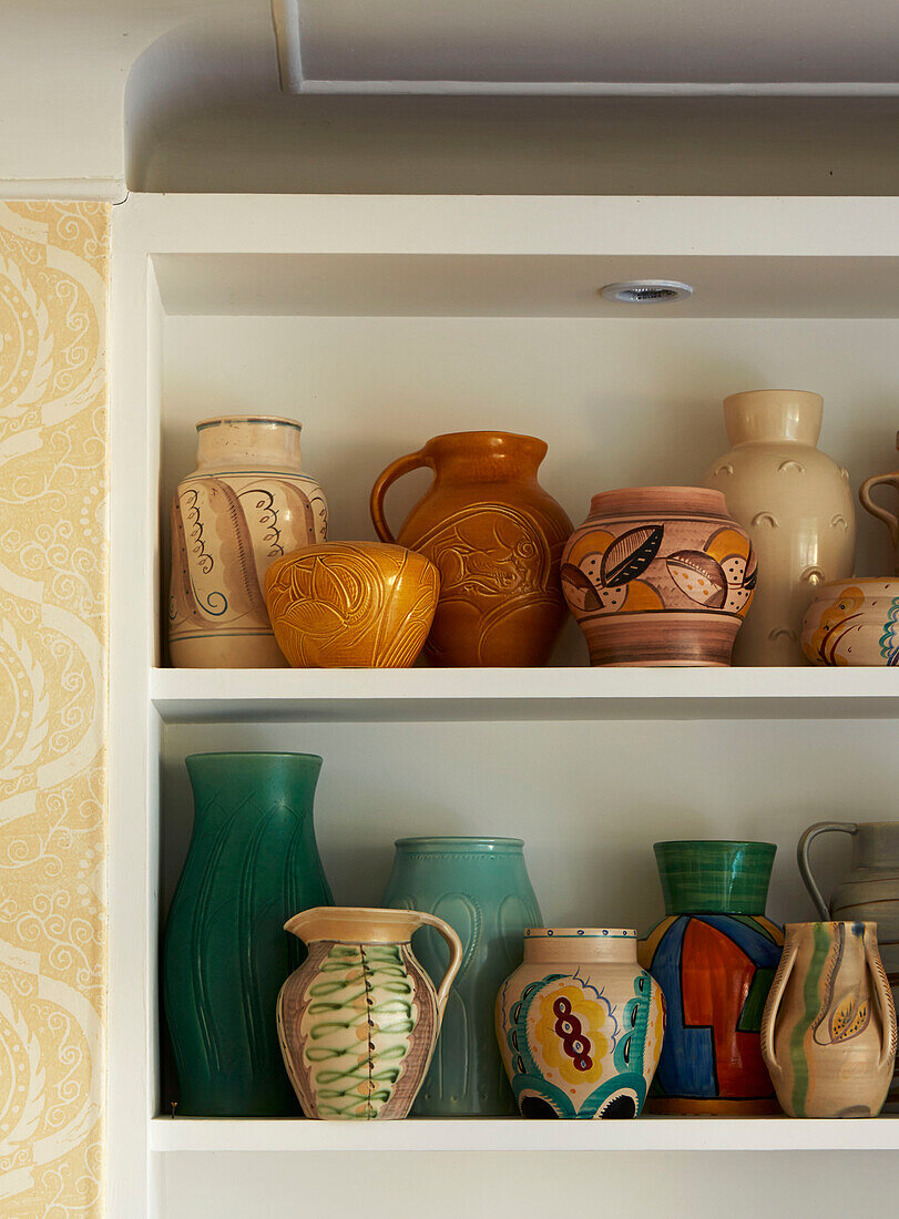 ceramic homeware on shelving in London home, England, UK