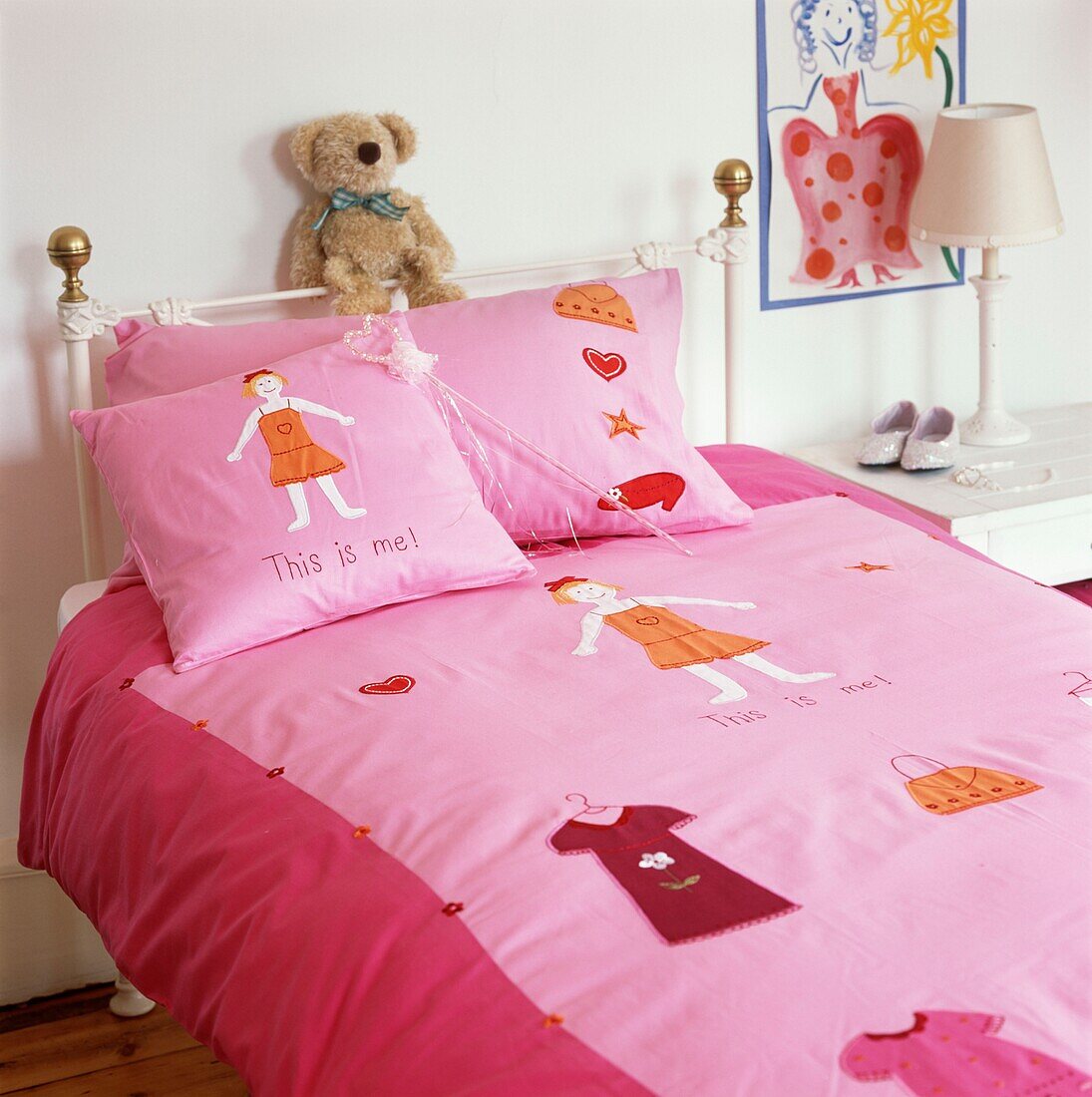 Pink duvet on single bed with soft toy