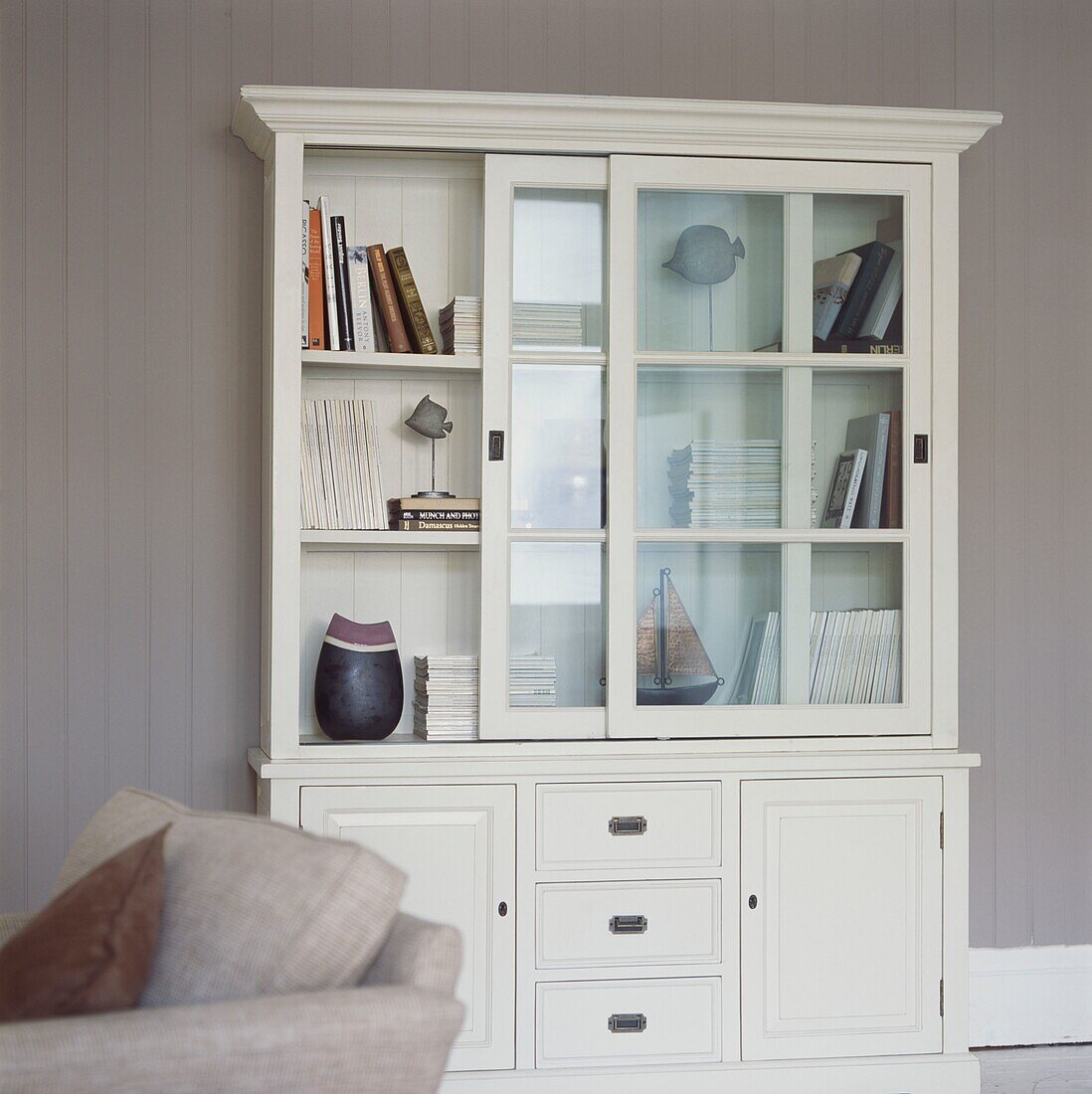 White painted dresser with glass-fronted sliding doors