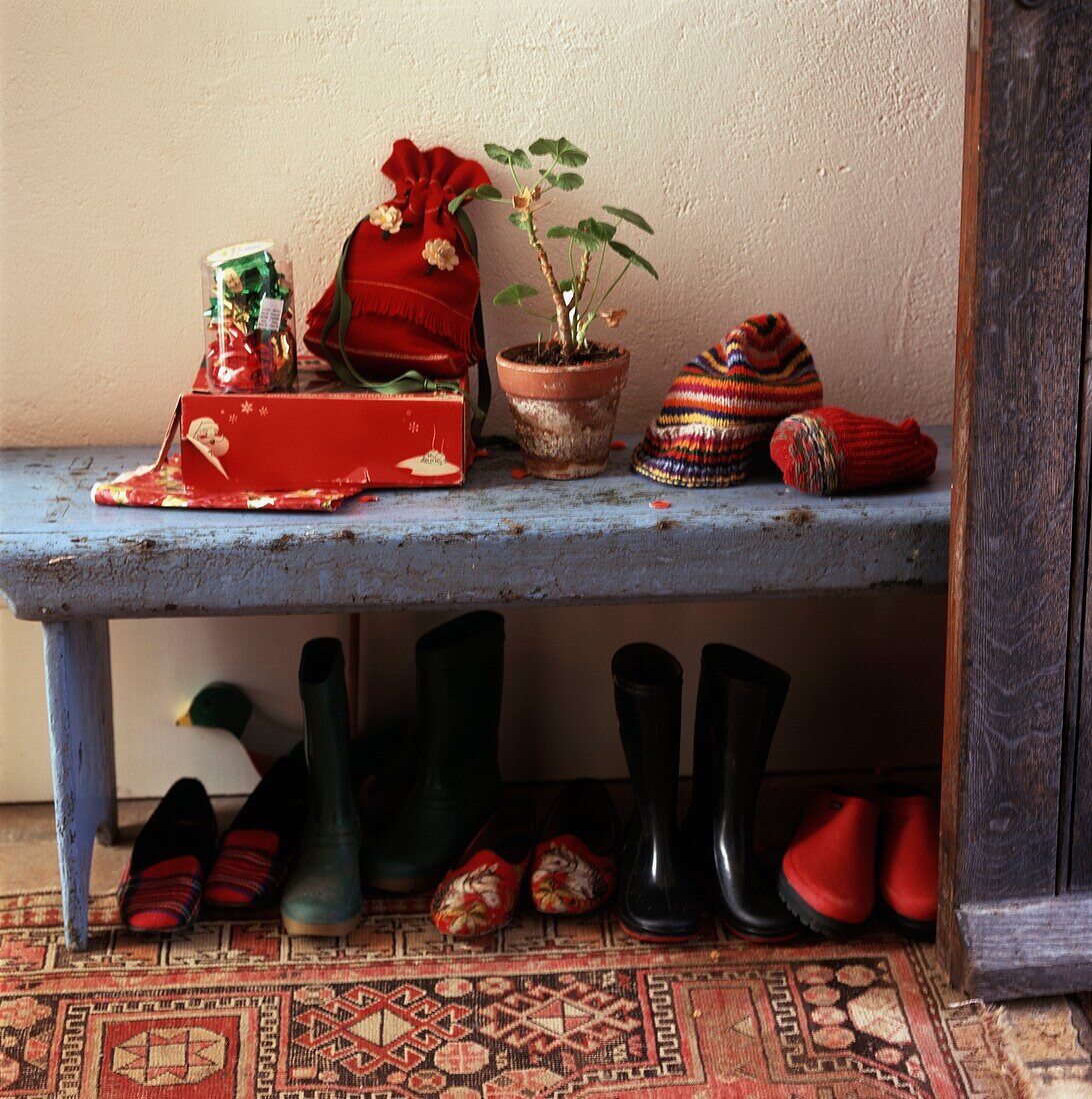 Table in entrance hall with shoes below