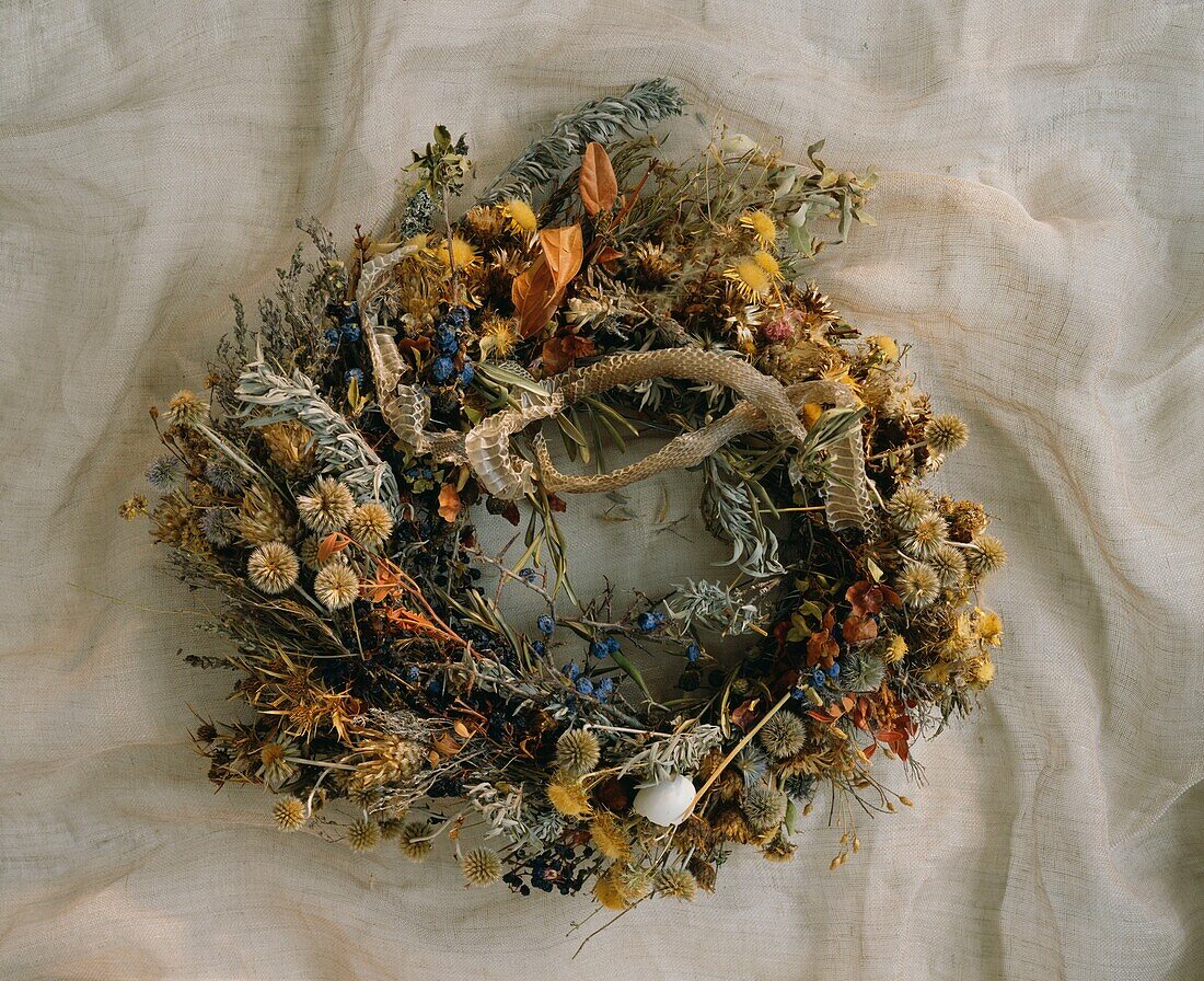 Wreath of dried flowers on fabric