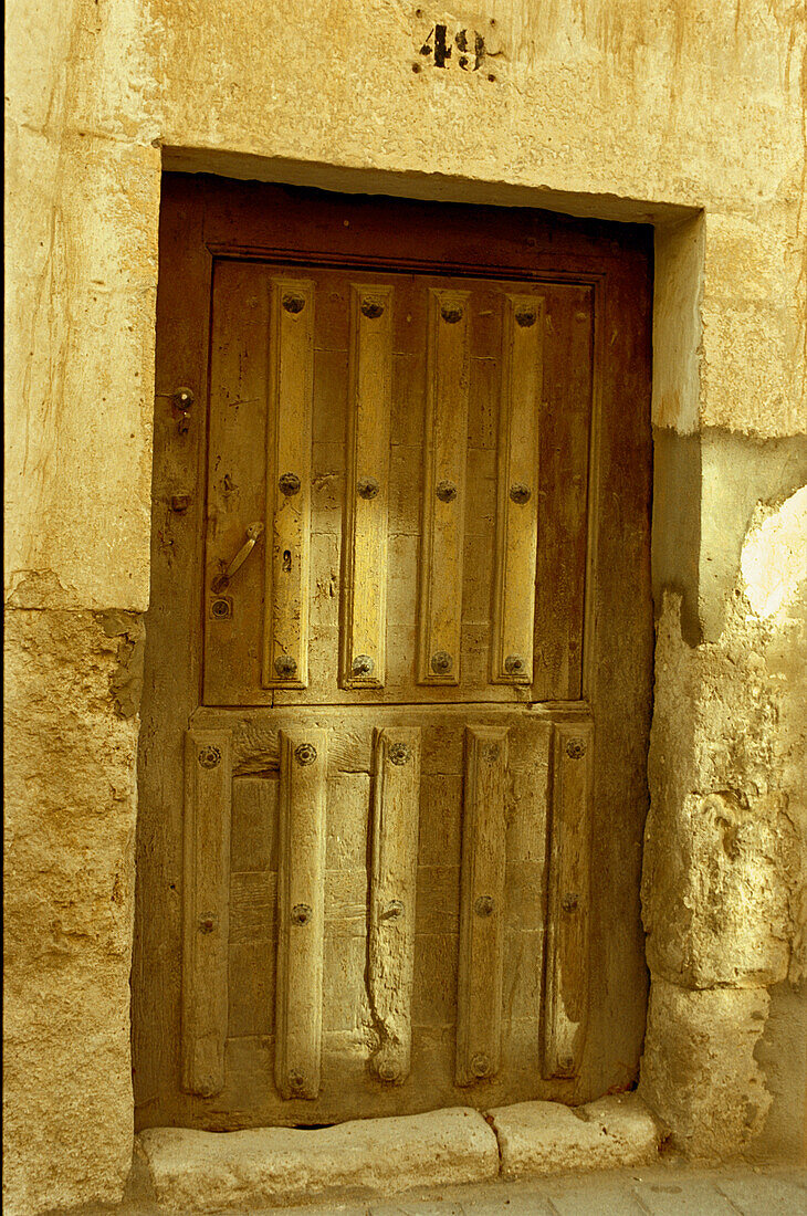 Medieval wooden door in Plaza del Coso in Penafiel
