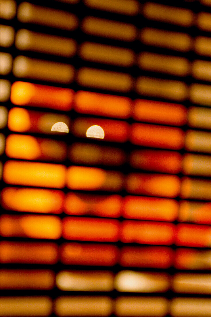 Light filtering through blinds in a modern tapas bar in Barcelona