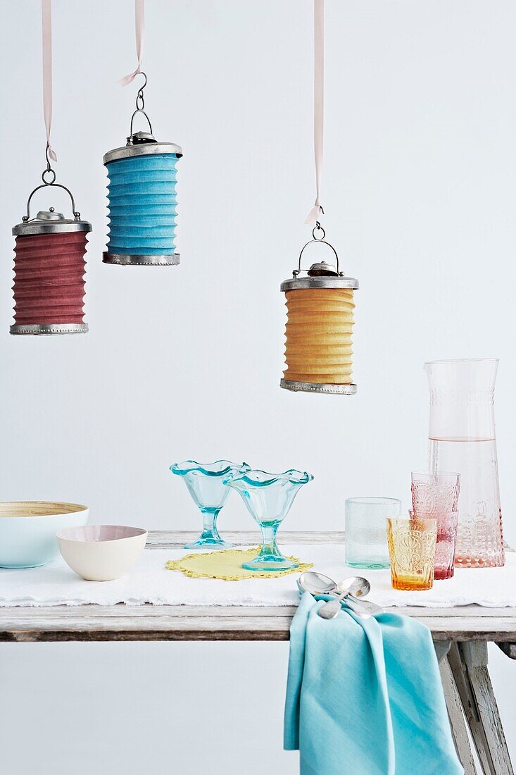 Multicoloured lanterns and coloured glassware