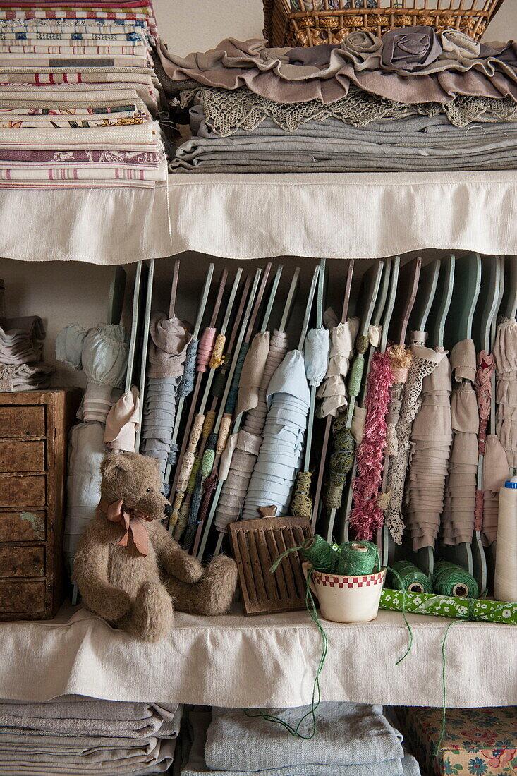 Teddybear with fabrics in Dordogne farmhouse interior,  France