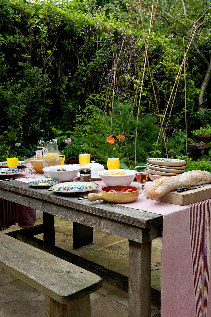 Picnic table set for lunch in Lewes garden,  East Sussex,  England,  UK