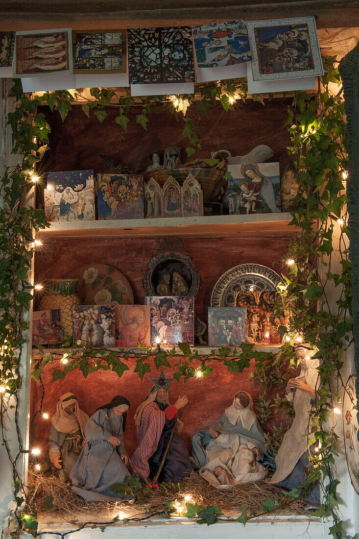 Christmas cards and nativity scene in recessed alcove of Benenden cottage,  Kent,  England,  UK