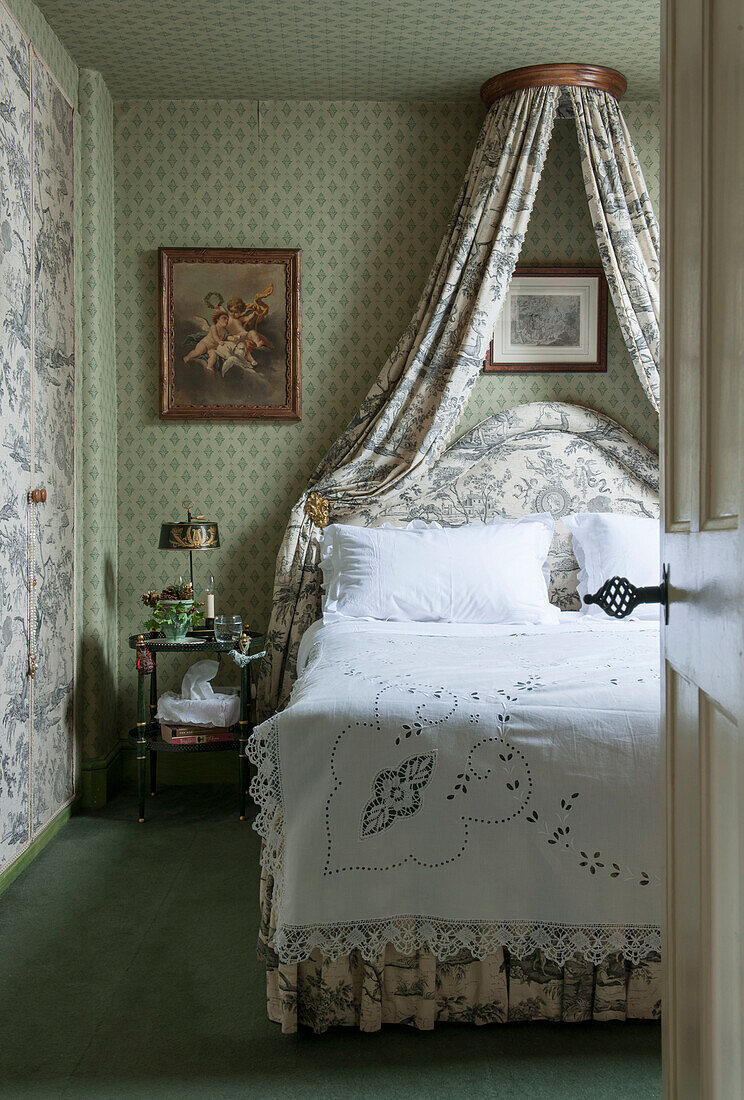 Toile de jouy bedroom with lace cover in London home  England  UK