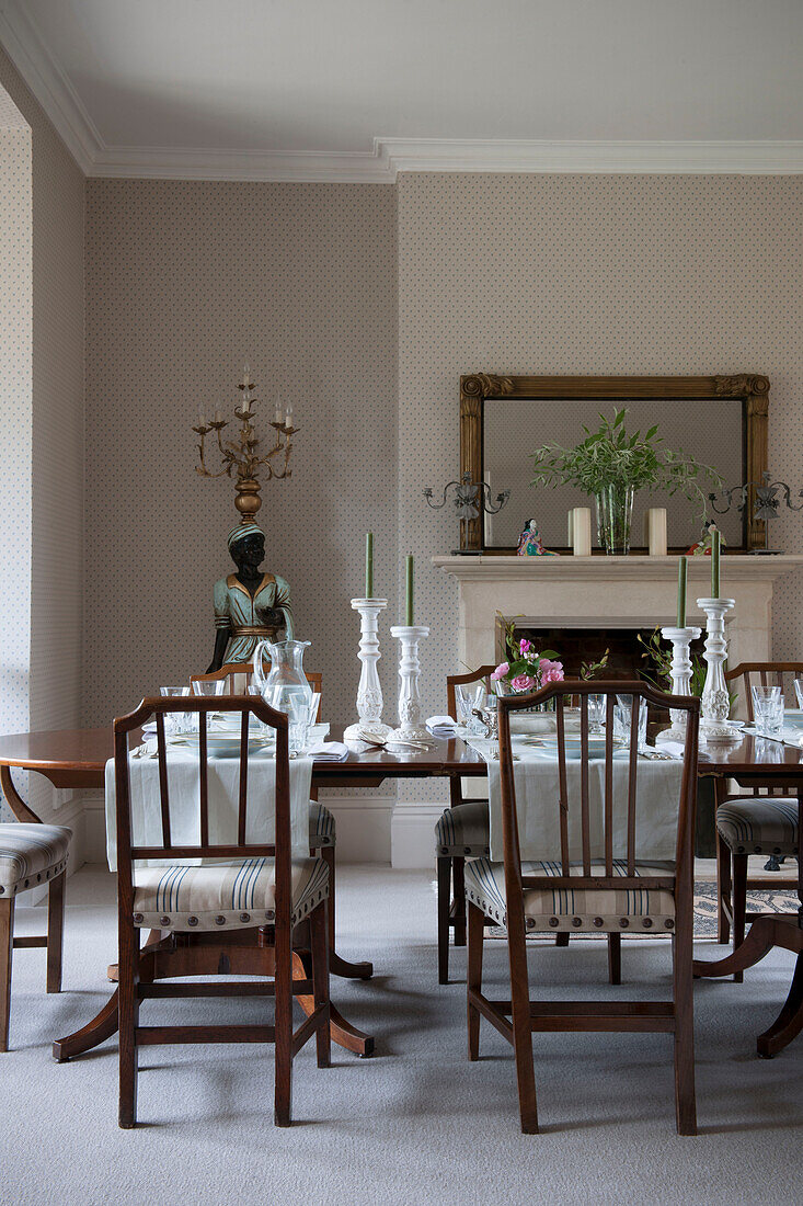Dining room with table set and figurative floor lamp