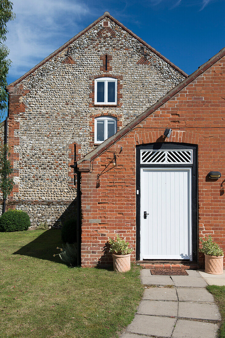 White back door of 18th century Norfolk barn conversion  England  UK