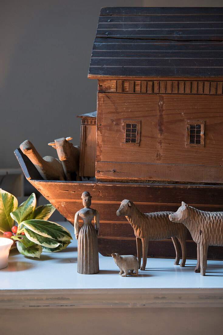 Carved wooden nativity figures and Noah's ark in North London Victorian house  England  UK