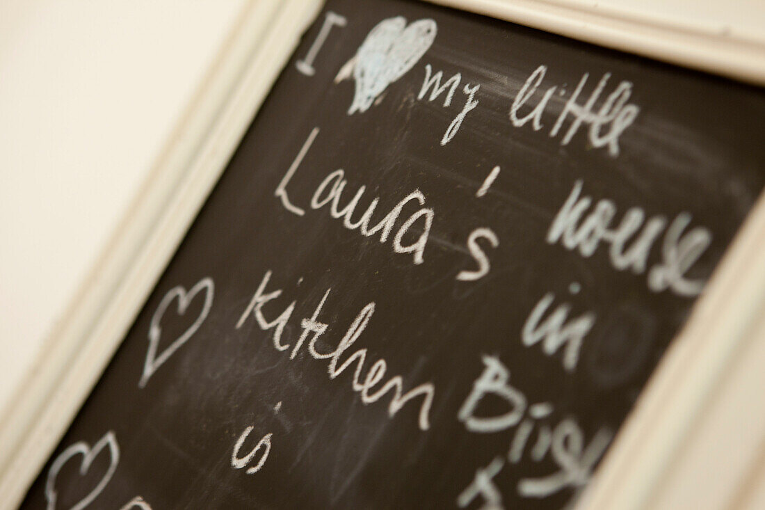 Handwriting on blackboard in Brighton kitchen, East Sussex, England, UK