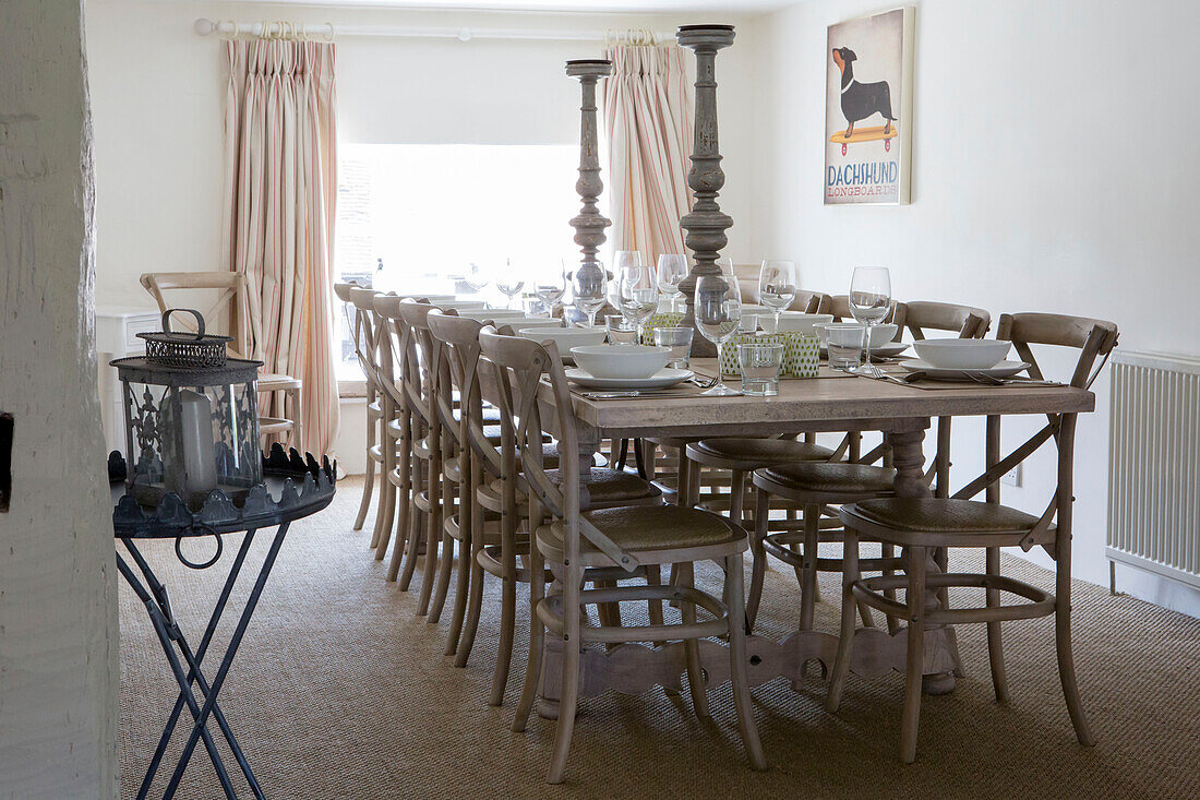 Large candlesticks on table for twelve in Petworth farmhouse West Sussex Kent
