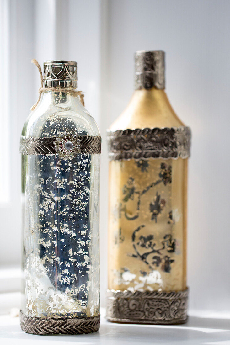 Two vintage bottles on windowsill in Petworth farmhouse West Sussex Kent