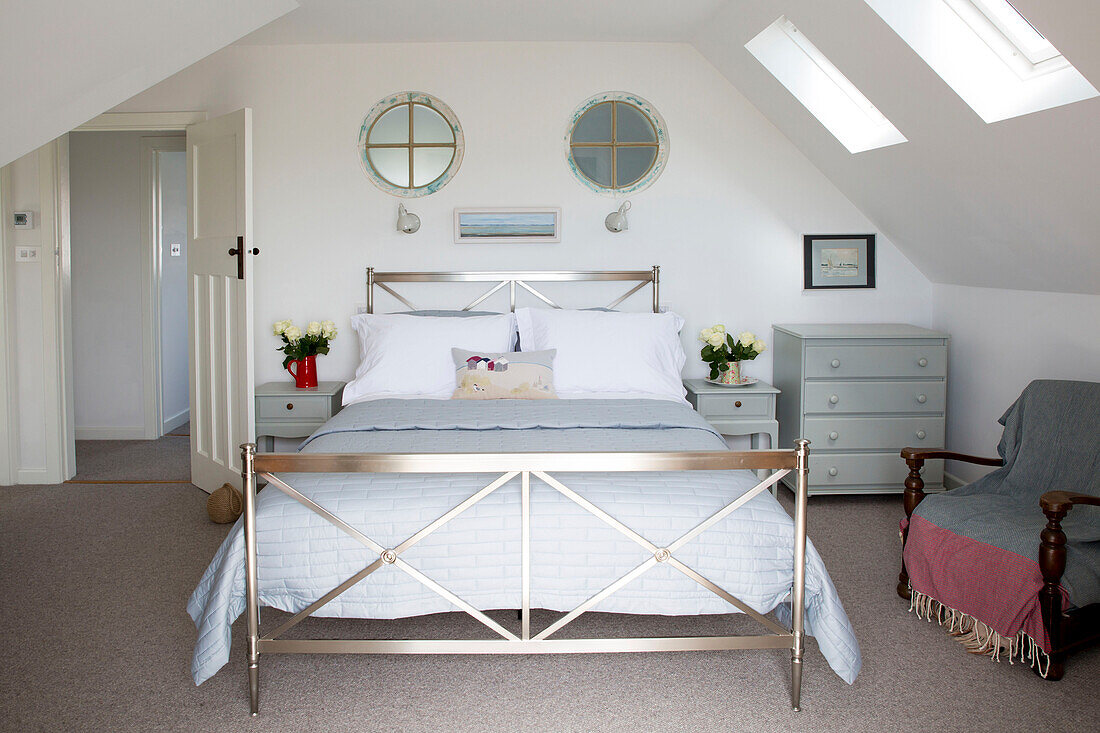Metal framed double bed in attic of West Wittering home West Sussex England