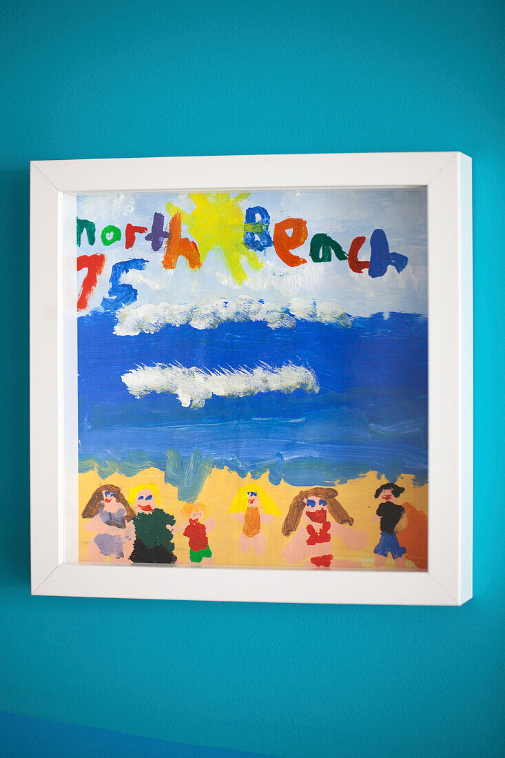Child's artwork framed in 1950s coastal beach house West Sussex UK