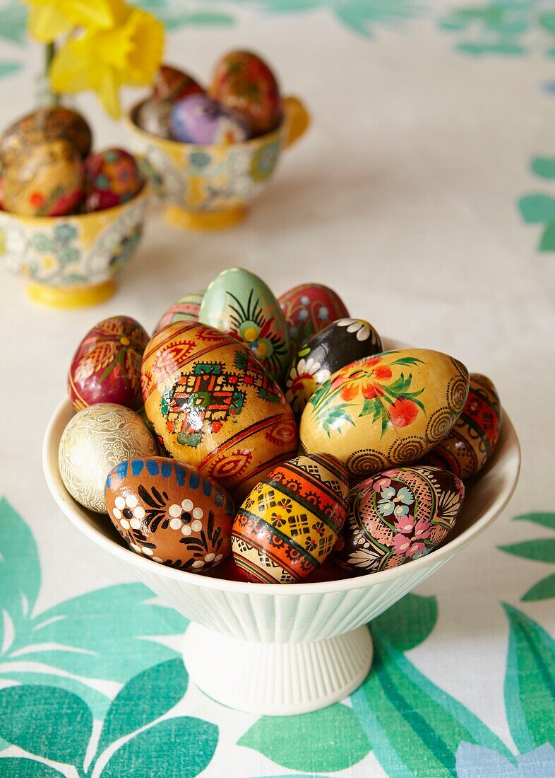 Hand-painted Easter eggs on kitchen table in London home   England   UK